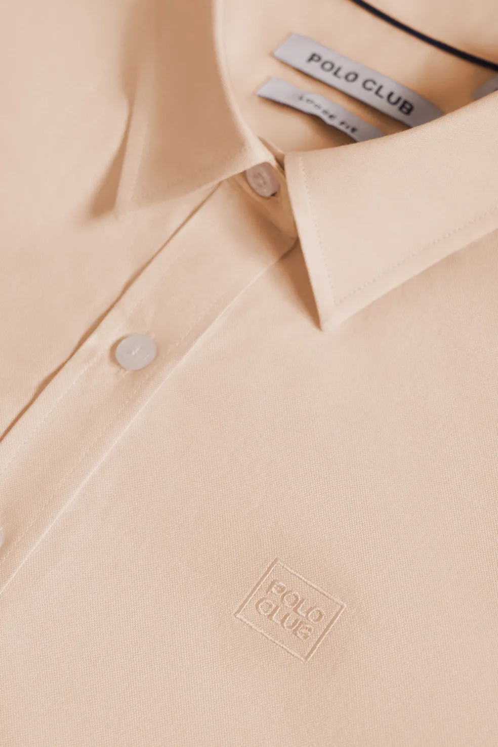Camisa oxford color melocotón con logo bordado