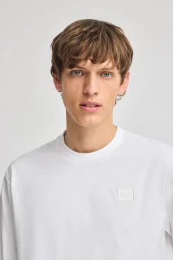 Camiseta blanca holgada con detalle Polo Club