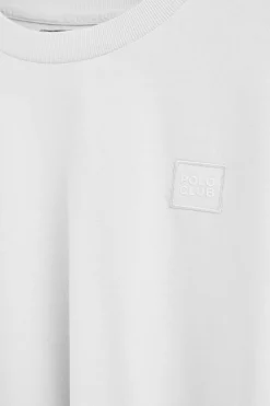 Camiseta blanca holgada con detalle Polo Club