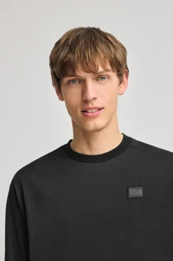 Camiseta negra holgada con detalle Polo Club