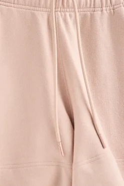 Pantalón corto de algodón color maquillaje con logo bordado
