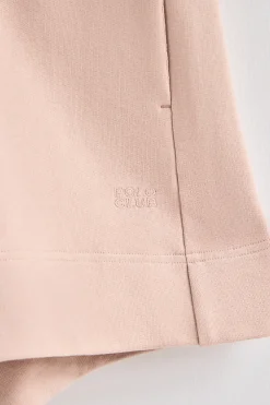 Pantalón corto de algodón color maquillaje con logo bordado