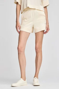 Pantalón corto de algodón color crudo con logo bordado