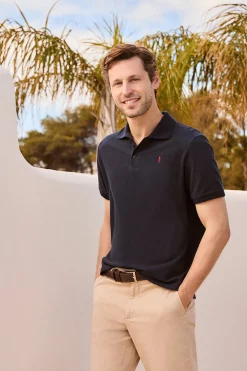 Polo azul marino de manga corta y tres botones con logo bordado Rigby Go