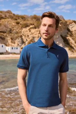 Polo azul índigo de manga corta y tres botones con logo bordado Rigby Go