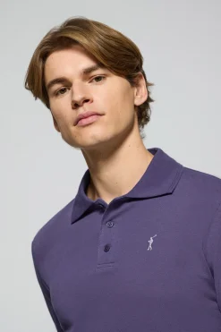 Polo de manga larga de tres botones en azul océano con logo Rigby Go