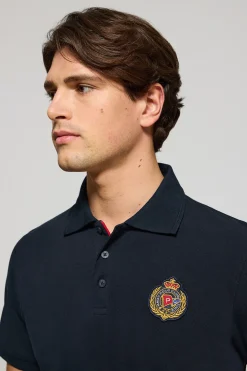 Polo Nautic azul marino con detalle de parche naútico en el pecho