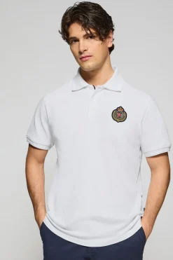 Polo Nautic blanco con detalle de parche naútico en el pecho