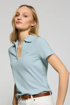 Polo Pedraza sin botones azul claro con logo engomado Polo Club