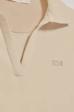 Polo Pia beige sin botones con logo Polo Club engomado
