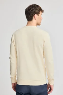 Sudadera color crudo regular de cuello redondo y print engomado
