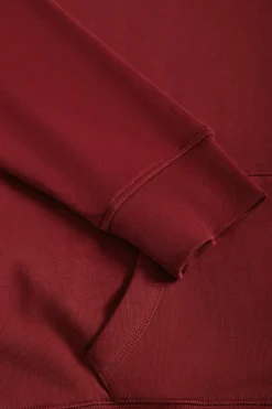 Sudadera con capucha y bolsillos granate con logo Rigby Go