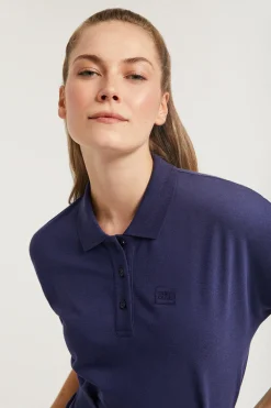 Vestido azul marino con manga dolman y bordado al tono